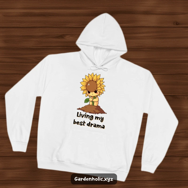 Funny hoodie showing a determined sunflower dramatically wilting into a pile of soil, ideal for cozy, humorous downtime.