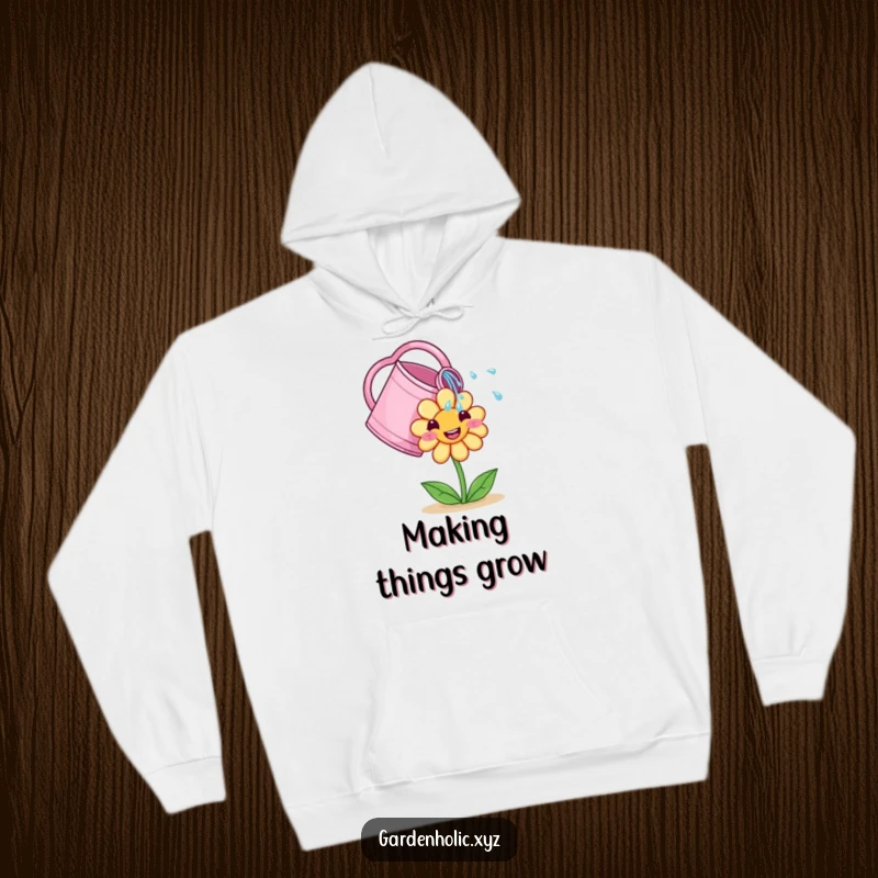 Funny Hoodie: A cute watering can showers a smiling flower, designed for cozy gardening moments and humor.